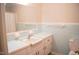 Bathroom with a vintage sink, cabinets and fixtures and blue tile details at 1307 Sycamore Dr, Garner, NC 27529