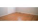 Bedroom with neutral paint, hardwood floors, and a large door at 1307 Sycamore Dr, Garner, NC 27529