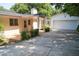 Charming home featuring a brick exterior, covered porch, attached garage, and well-maintained landscaping at 1307 Sycamore Dr, Garner, NC 27529