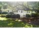 Charming home with a well-manicured lawn and mature landscaping, including a large shade tree at 1307 Sycamore Dr, Garner, NC 27529
