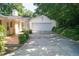This well-maintained garage is part of a charming home with a mature treeline at 1307 Sycamore Dr, Garner, NC 27529