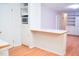 Kitchen features an eat-in counter area with built-in microwave and storage cabinets at 1307 Sycamore Dr, Garner, NC 27529