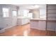 Spacious kitchen featuring white cabinets, modern appliances, and a convenient breakfast bar seating area at 1307 Sycamore Dr, Garner, NC 27529