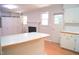 Bright open floor plan shows eat-in kitchen with breakfast bar leading to living room with fireplace at 1307 Sycamore Dr, Garner, NC 27529