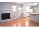 Bright open floor plan with wood floors, fireplace, and Kitchen access makes entertaining a breeze at 1307 Sycamore Dr, Garner, NC 27529