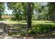Community park with a wooden fence and green space at 1307 Sycamore Dr, Garner, NC 27529