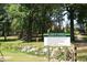 Park welcomes visitors with clear rules about hours, leashes, cleanliness, and emergency contact information at 1307 Sycamore Dr, Garner, NC 27529