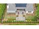 A straight down aerial view of the landscaped backyard with a brick water feature, patio, and solar panels at 1312 Duplin Rd, Raleigh, NC 27607