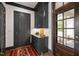 Elegant entryway featuring custom cabinets, a marble countertop, and a decorative rug at 1312 Duplin Rd, Raleigh, NC 27607