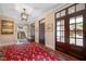 Elegant foyer with hardwood floors, beautiful rug, and sophisticated lighting at 1312 Duplin Rd, Raleigh, NC 27607
