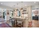 Charming kitchen with marble countertops, island seating, and stainless steel appliances at 1312 Duplin Rd, Raleigh, NC 27607