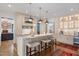 Charming kitchen with marble countertops, island seating, and stainless steel appliances at 1312 Duplin Rd, Raleigh, NC 27607