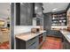 Modern kitchen with custom cabinets, marble countertops, and stainless steel appliances at 1312 Duplin Rd, Raleigh, NC 27607