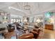 Spacious living room with vaulted ceiling, stylish decor, and ample seating at 1312 Duplin Rd, Raleigh, NC 27607