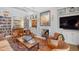 Cozy living room with fireplace, built-in shelves, and comfortable seating for guests at 1312 Duplin Rd, Raleigh, NC 27607