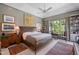 Serene main bedroom featuring ample natural light, stylish decor, and custom built-in bookshelves at 1312 Duplin Rd, Raleigh, NC 27607