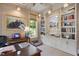 Charming home office with beautiful built-in bookshelves and a large window at 1312 Duplin Rd, Raleigh, NC 27607