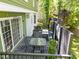 Back deck featuring a table and chairs and a grill at 1408 Bridgeport Dr, Raleigh, NC 27615