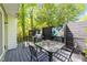 Back deck featuring a table and chairs and a grill at 1408 Bridgeport Dr, Raleigh, NC 27615