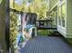 Cozy deck with a playhouse, space for dining, and stylish black horizontal fencing at 1408 Bridgeport Dr, Raleigh, NC 27615