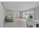 Bright living room with neutral paint, large windows, and comfortable seating at 1408 Bridgeport Dr, Raleigh, NC 27615