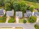 Aerial view of neighborhood featuring well-manicured lawns and mature trees at 1412 Kings Lassiter Way, Raleigh, NC 27614