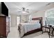 Spacious bedroom with a ceiling fan, and an ensuite bathroom at 1412 Kings Lassiter Way, Raleigh, NC 27614