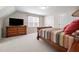 Bedroom featuring neutral walls, carpet, a wooden bedframe, a dresser, and two closets at 1412 Kings Lassiter Way, Raleigh, NC 27614