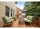 An inviting outdoor space featuring comfortable seating and a built-in grill at 1412 Kings Lassiter Way, Raleigh, NC 27614