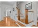 Inviting foyer with hardwood floors and staircase leading to the upper level at 1412 Kings Lassiter Way, Raleigh, NC 27614