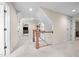 Upstairs hallway featuring neutral carpeting, white trim and multiple rooms at 1412 Kings Lassiter Way, Raleigh, NC 27614