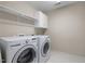 Bright laundry room featuring a washer, a dryer, and some storage space at 1412 Kings Lassiter Way, Raleigh, NC 27614