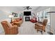 Inviting living room with fireplace, media center and stylish furnishings for relaxation at 1412 Kings Lassiter Way, Raleigh, NC 27614