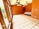Bright bedroom featuring tile floors, high ceilings, and large windows offering abundant natural light at 145 Ryan Rd, Pittsboro, NC 27312