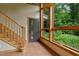 Bright foyer featuring a staircase, tile floor and picturesque windows at 145 Ryan Rd, Pittsboro, NC 27312