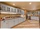 Traditional kitchen with tile floor, neutral counters, and white cabinets at 145 Ryan Rd, Pittsboro, NC 27312
