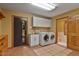 Bright laundry room with a modern washer and dryer at 145 Ryan Rd, Pittsboro, NC 27312