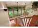 Bright sunroom with large windows, wood beams, and views of the landscaped backyard at 145 Ryan Rd, Pittsboro, NC 27312