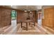 Living room area featuring brick wall and fireplace at 145 Ryan Rd, Pittsboro, NC 27312