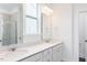 Bathroom features a double sink vanity, large mirrors, and modern fixtures at 173 Little Creek Dr, Lillington, NC 27546