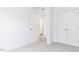 Bedroom featuring neutral carpet, white walls, and closet with bi-fold doors at 173 Little Creek Dr, Lillington, NC 27546