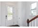 The foyer features a glass paneled front door, hardwood floors, and a bright and airy feel at 173 Little Creek Dr, Lillington, NC 27546