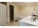 Clean bathroom featuring a bathtub, dual sinks, and plenty of counter space at 1911 Falls Landing Dr # 103, Raleigh, NC 27614