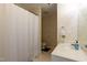 Bright bathroom with a shower and tub, plus a modern vanity and fixtures at 1911 Falls Landing Dr # 103, Raleigh, NC 27614