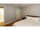 Comfortable bedroom featuring a ceiling fan, hardwood floors and a large window at 1911 Falls Landing Dr # 103, Raleigh, NC 27614