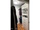 Well-organized closet with custom shelving, clothing racks, drawers, and wood flooring at 1911 Falls Landing Dr # 103, Raleigh, NC 27614