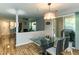 Open dining space with glass table and seamless flow into the adjacent living area at 1911 Falls Landing Dr # 103, Raleigh, NC 27614