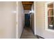 Exterior entryway with a black door and secure lockbox on a light-colored wall at 1911 Falls Landing Dr # 103, Raleigh, NC 27614