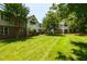 Well-maintained lawn area with mature trees and multi-story condominium buildings at 1911 Falls Landing Dr # 103, Raleigh, NC 27614