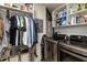 Well-organized laundry room features shelving, front load washer and dryer, and ample storage at 1911 Falls Landing Dr # 103, Raleigh, NC 27614